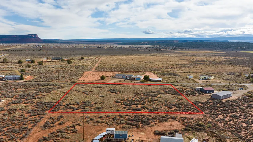 Aerial view of sparsely populated area featuring property parcel outlined and a desert landscape