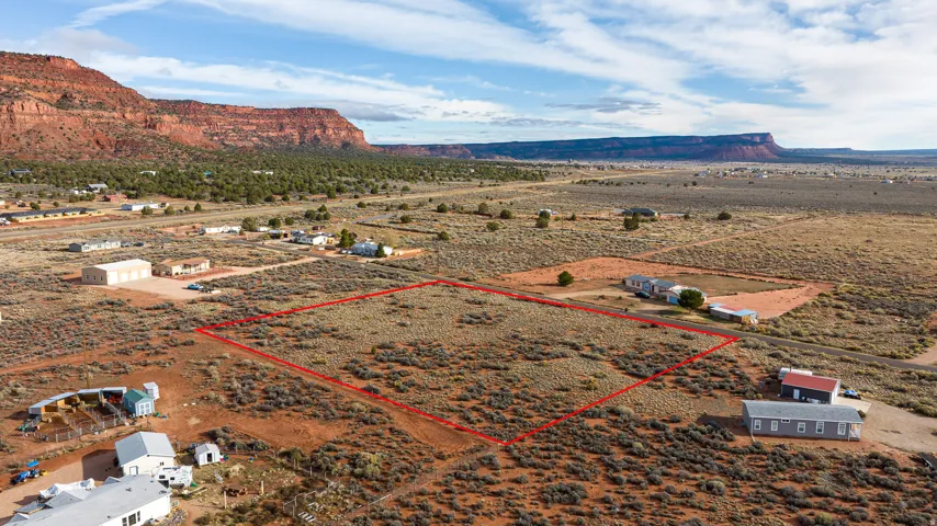 Overview of rural landscape featuring property parcel outlined and mountains