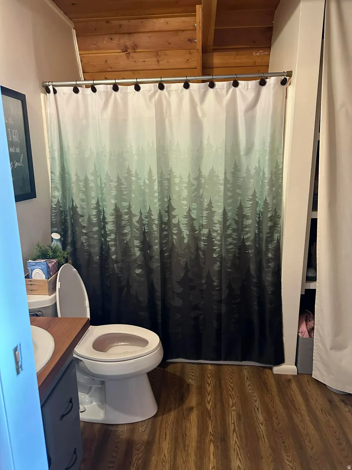 Full bath with a shower with curtain, vanity, dark wood-style floors, and wood ceiling