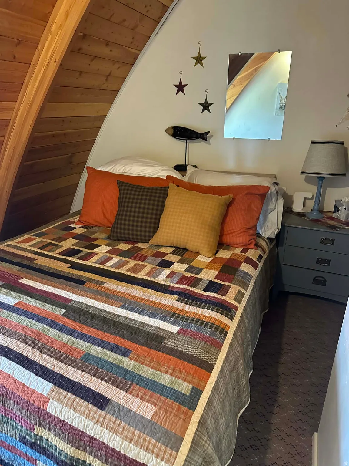 Bedroom with wooden ceiling and vaulted ceiling