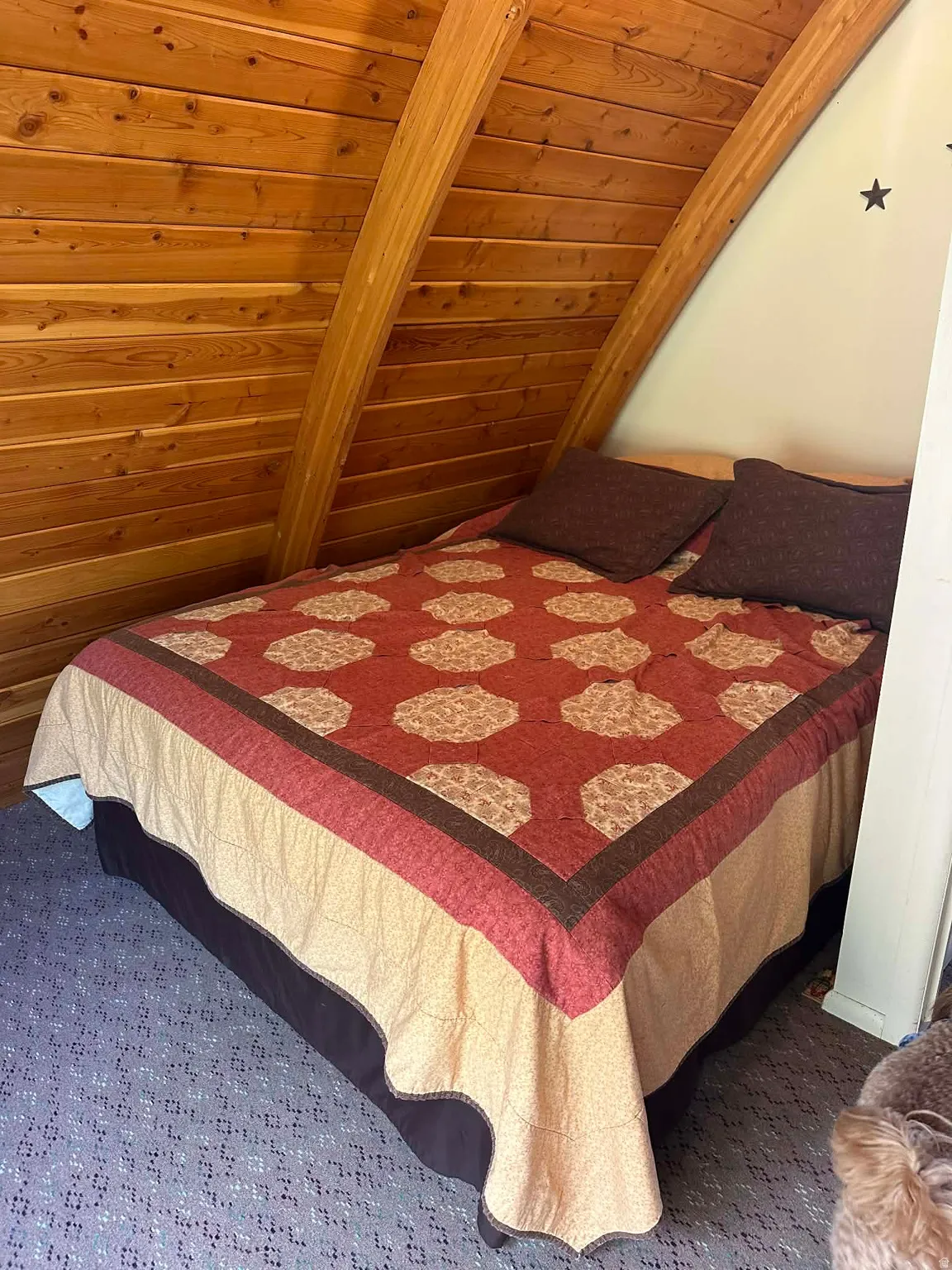 Carpeted bedroom with wood ceiling