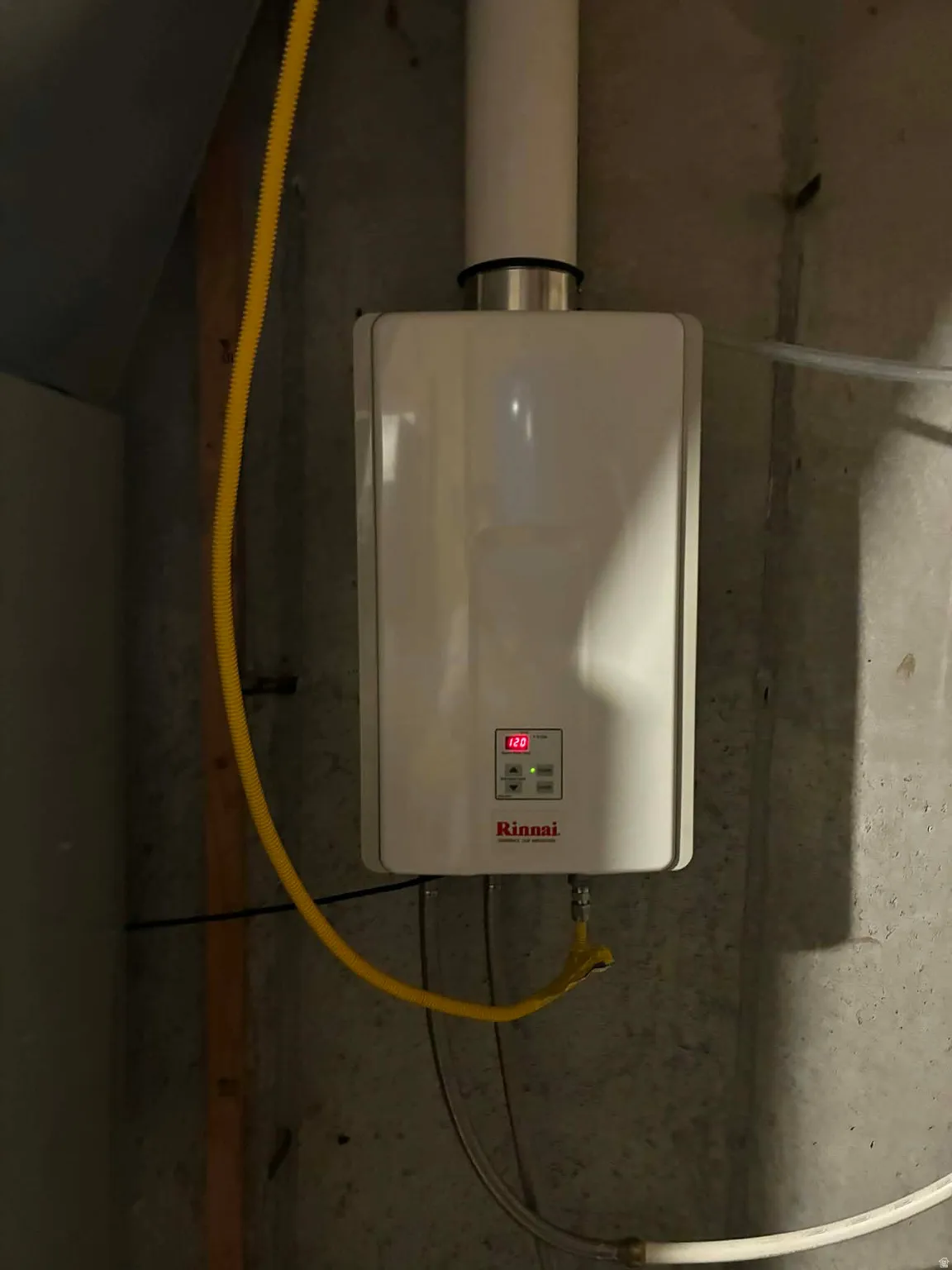 Utility room featuring water heater