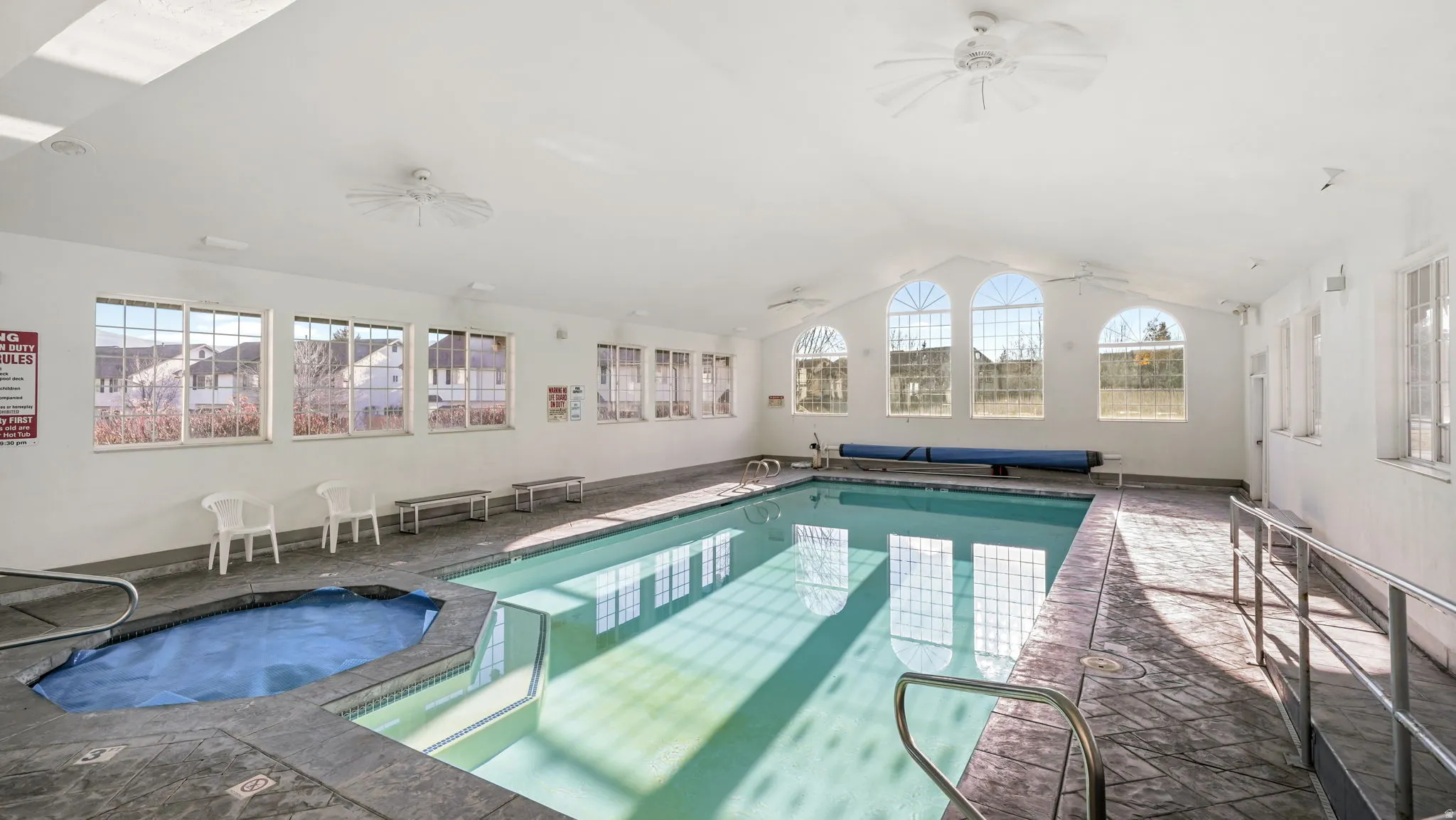 Indoor community pool with ceiling fan