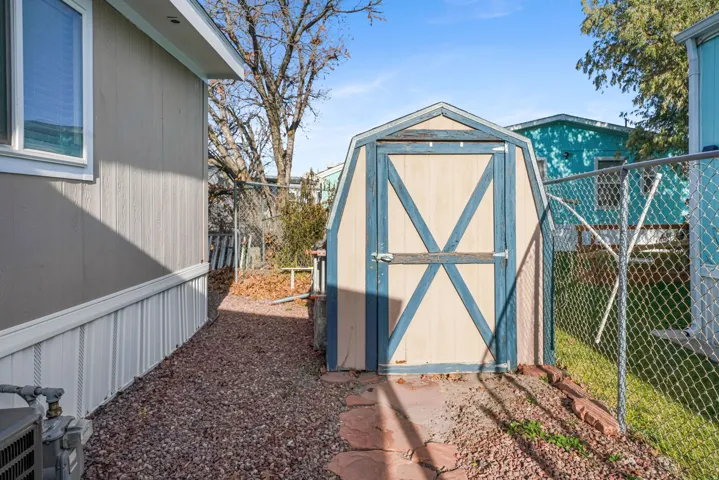 View of shed featuring a fenced backyard