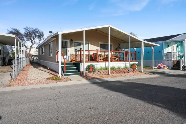 Manufactured / mobile home featuring an attached carport