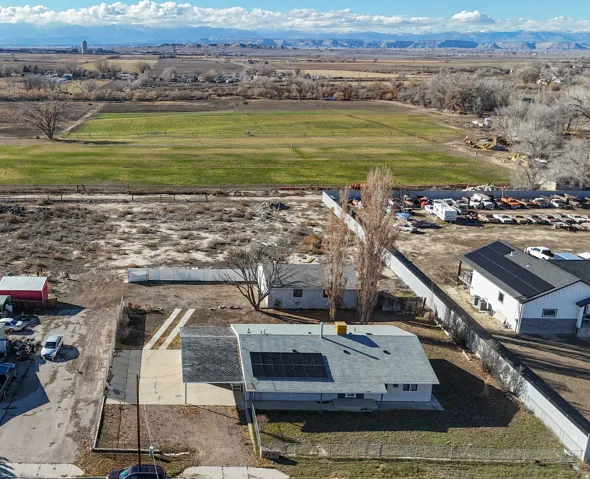 Aerial view of sparsely populated area with a mountainous background