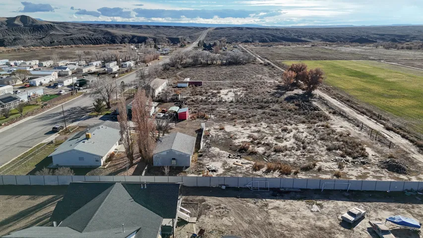 Aerial perspective of suburban area with a mountain backdrop
