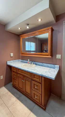 Bathroom with vanity and recessed lighting