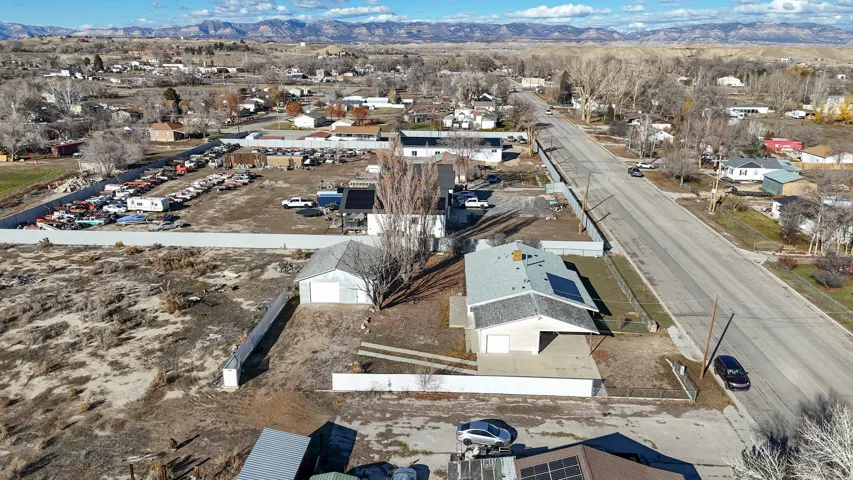 Aerial view of residential area with a mountain backdrop