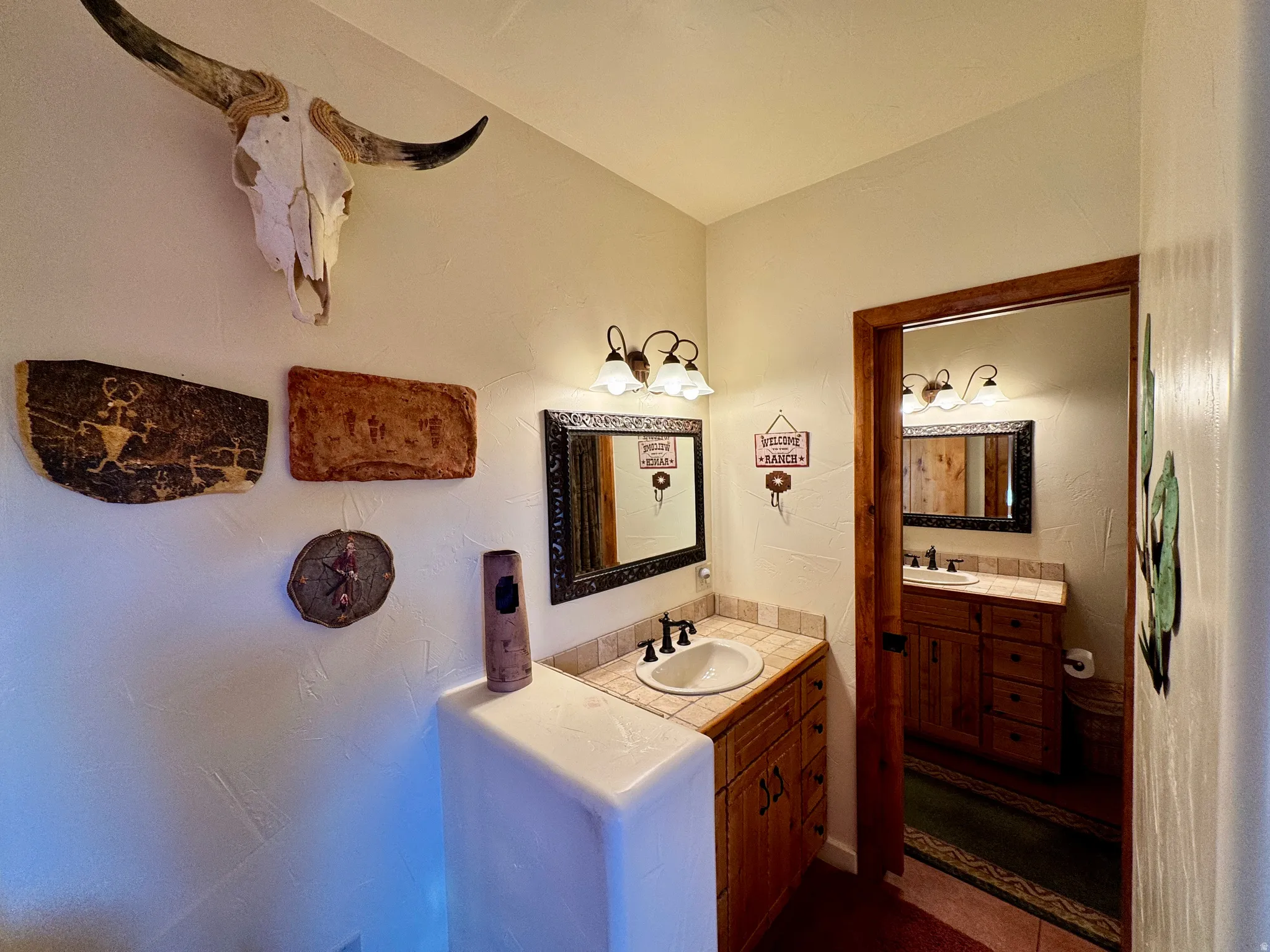 Bathroom featuring two vanities