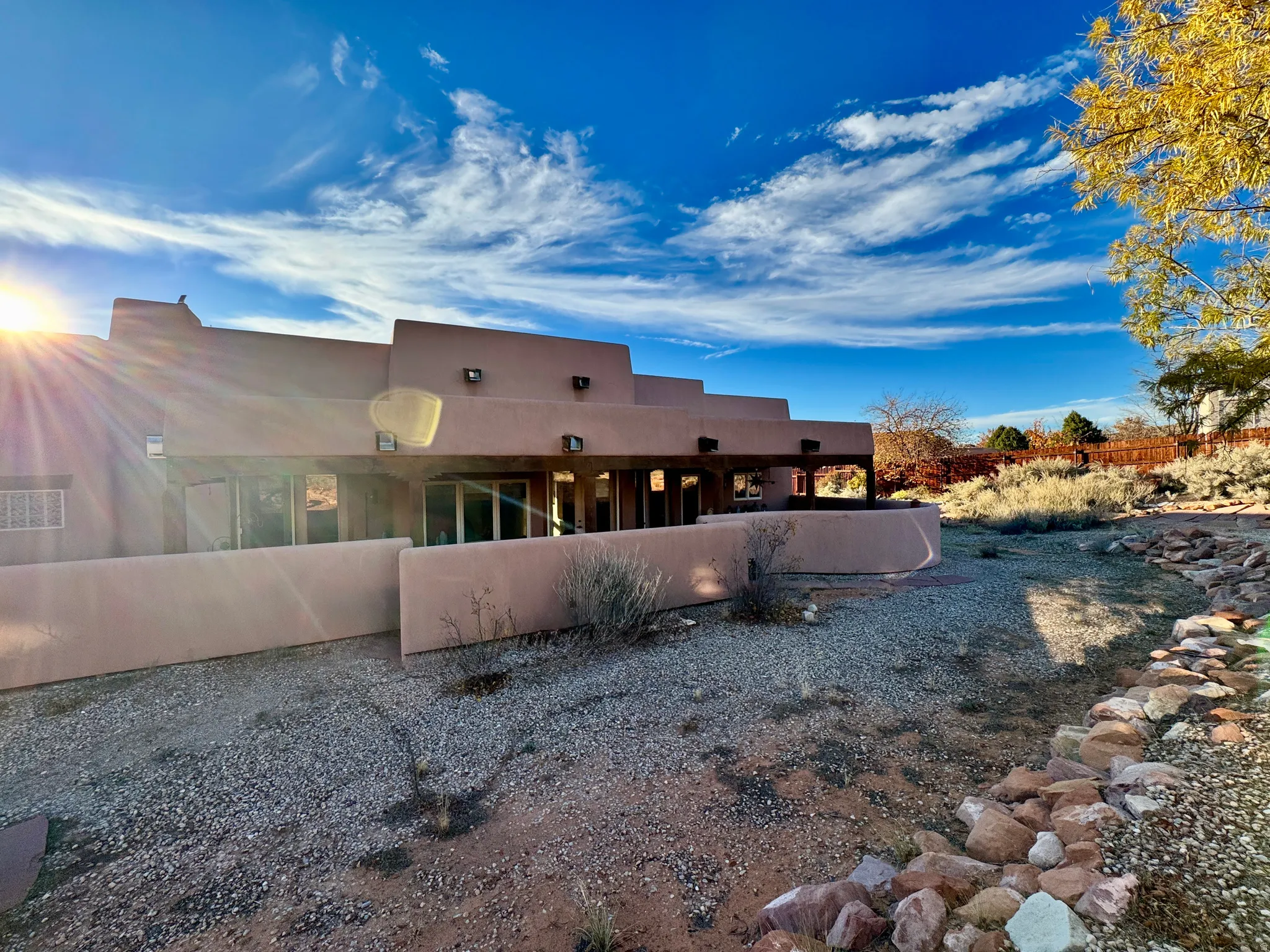 Rear view of house featuring stucco siding