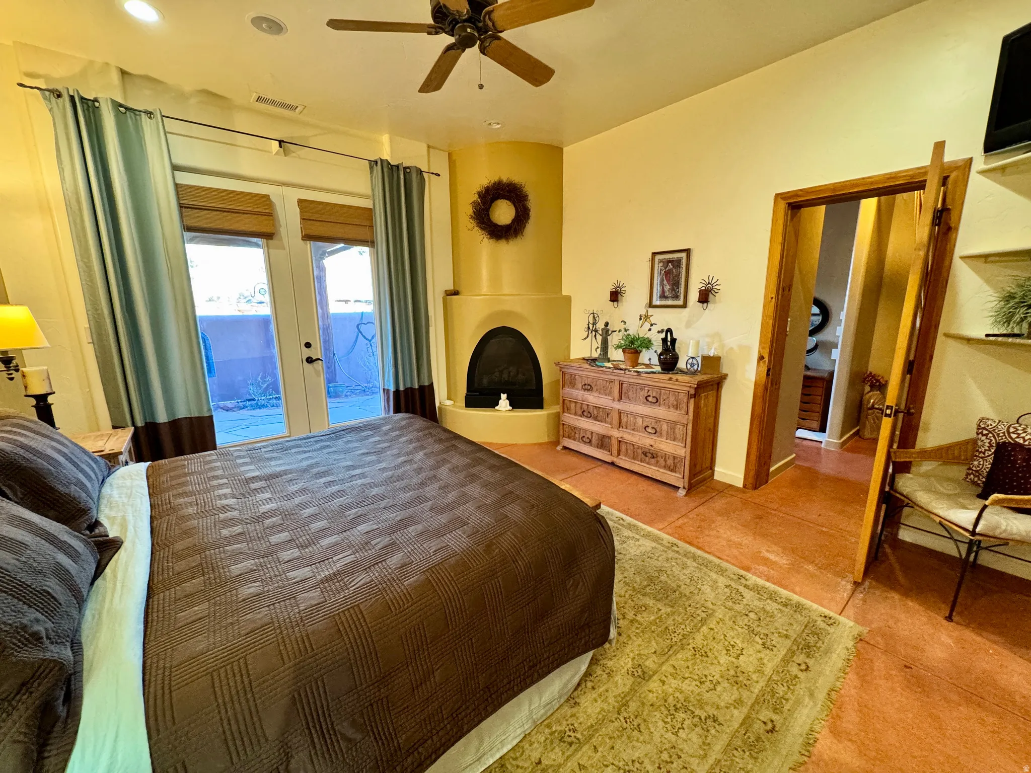 Bedroom featuring french doors, access to outside, and ceiling fan