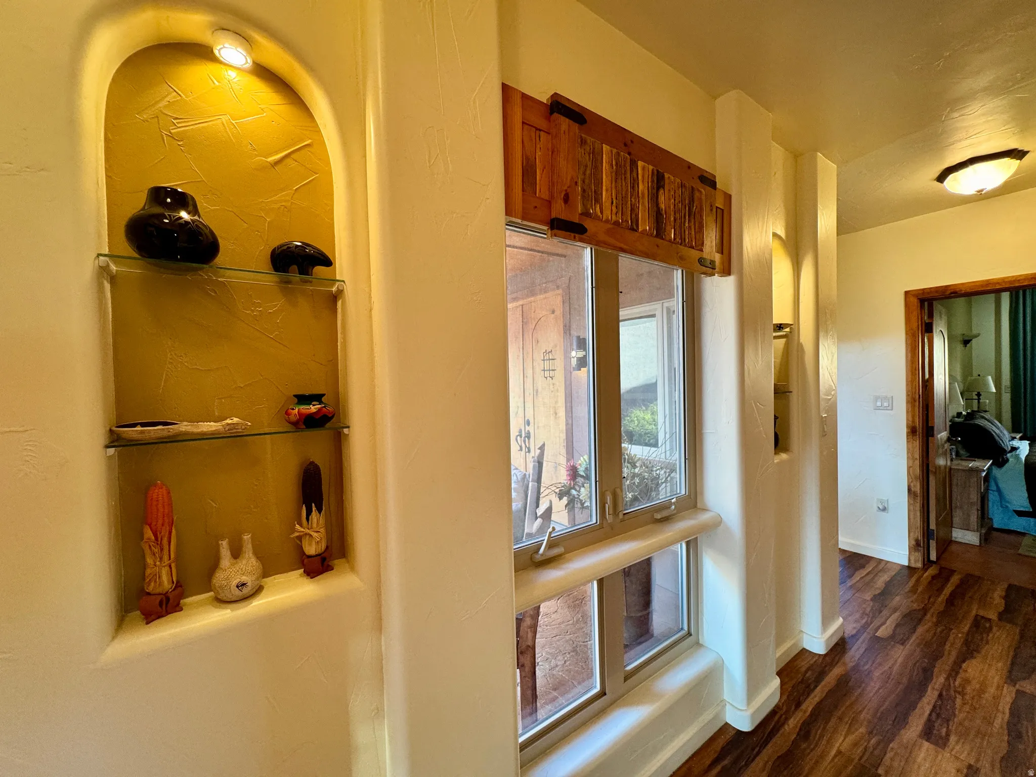 Hall with baseboards and dark wood finished floors