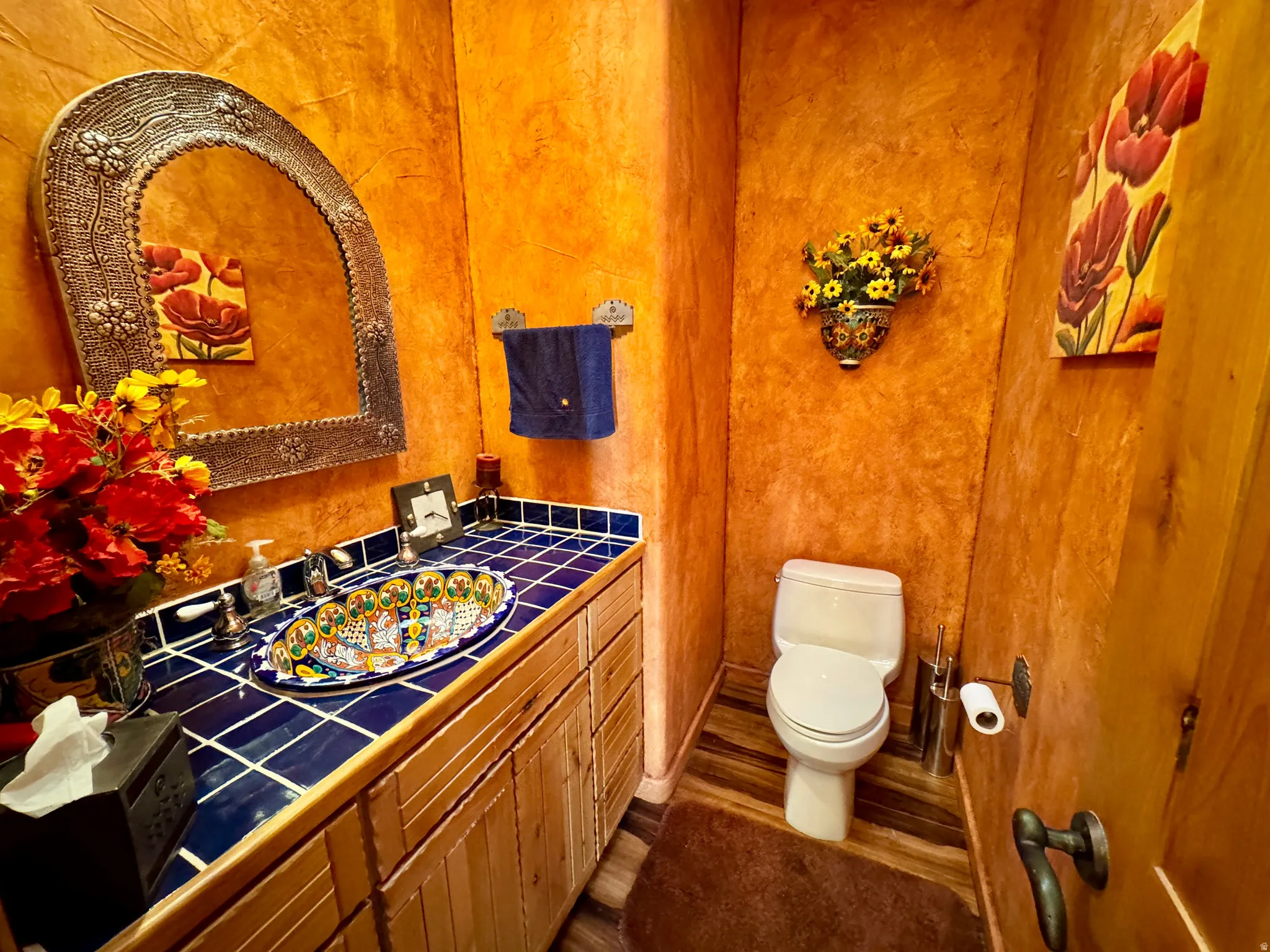 Bathroom featuring vanity and dark wood-style floors