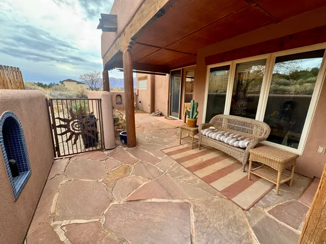 View of patio featuring a gate