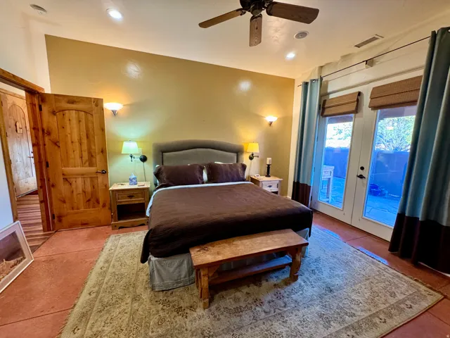 Bedroom featuring access to exterior, a ceiling fan, french doors, and recessed lighting
