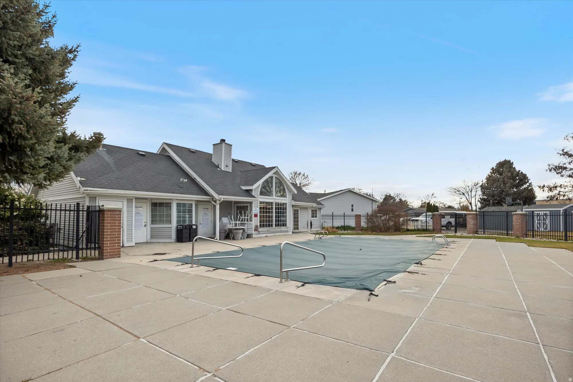 Community pool featuring a patio