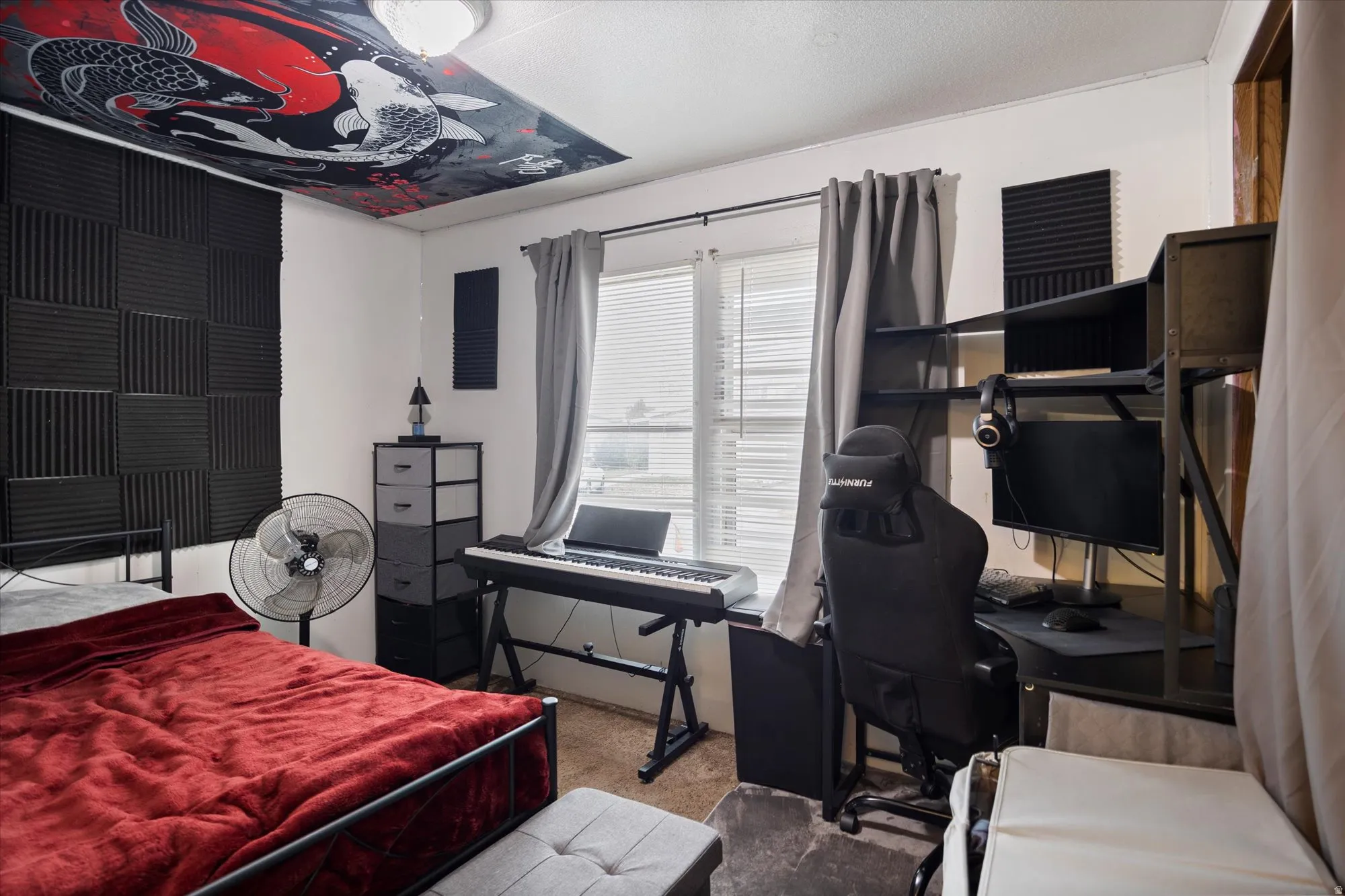 Bedroom with carpet flooring and a desk