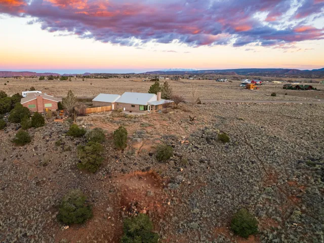 Aerial view of property and surrounding area with rural landscape