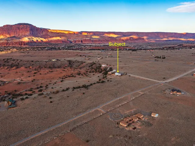 View of rural area featuring a desert landscape and a mountain backdrop