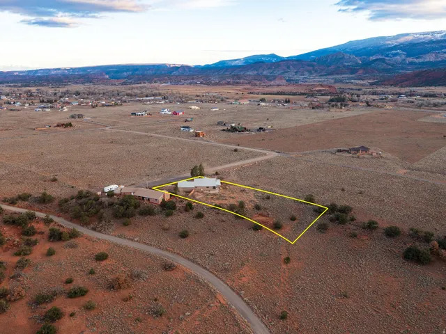 View of rural area with property boundaries highlighted and a mountainous background