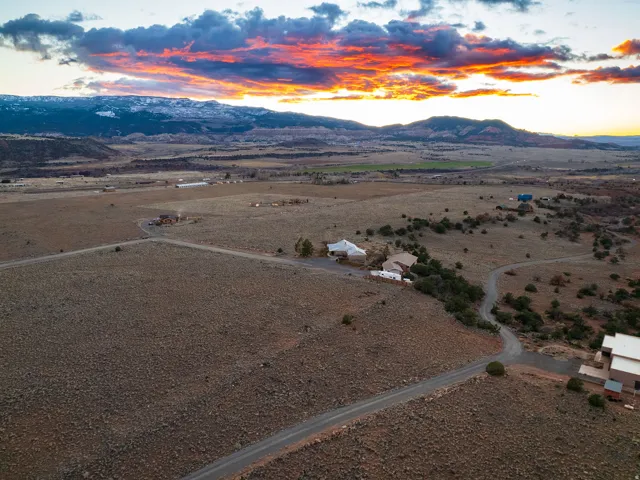 Aerial view at dusk of a mountain view and a view of countryside