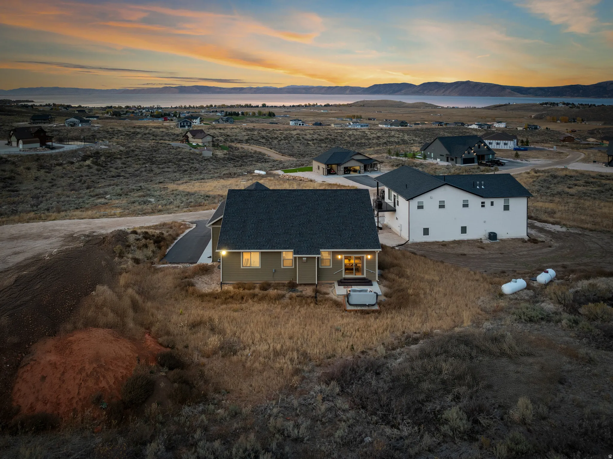 Aerial view of property and surrounding area with mountains