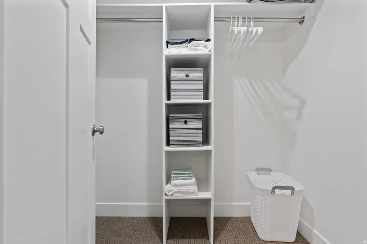 Walk in closet featuring carpet floors