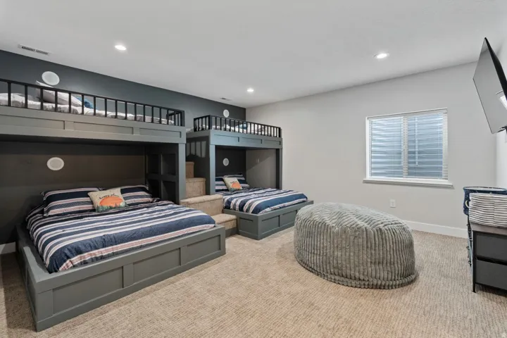 Carpeted bedroom featuring baseboards and recessed lighting