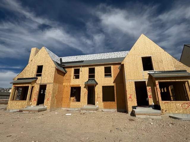 Unfinished property featuring a shingled roof