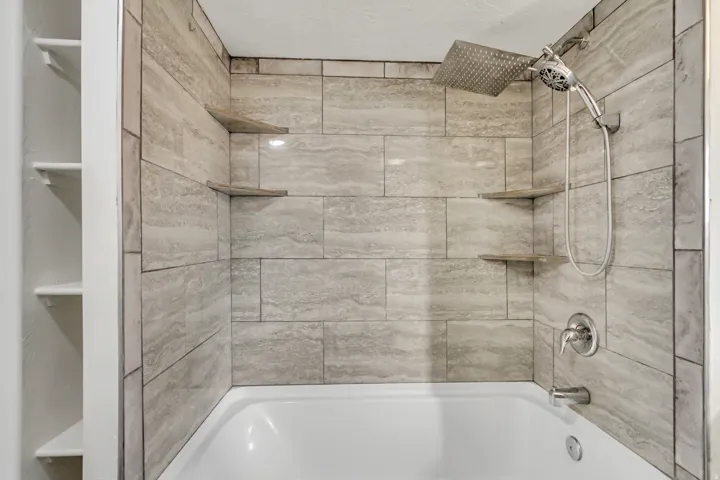 Bathroom featuring shower / washtub combination