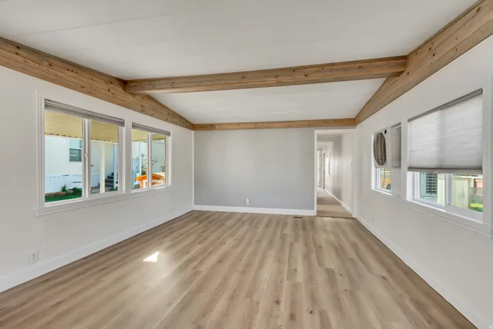 Unfurnished room with baseboards and light wood finished floors