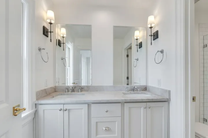 Full bath with toilet and double vanity