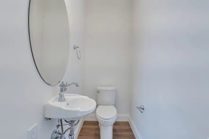 Bathroom with wood finished floors and toilet