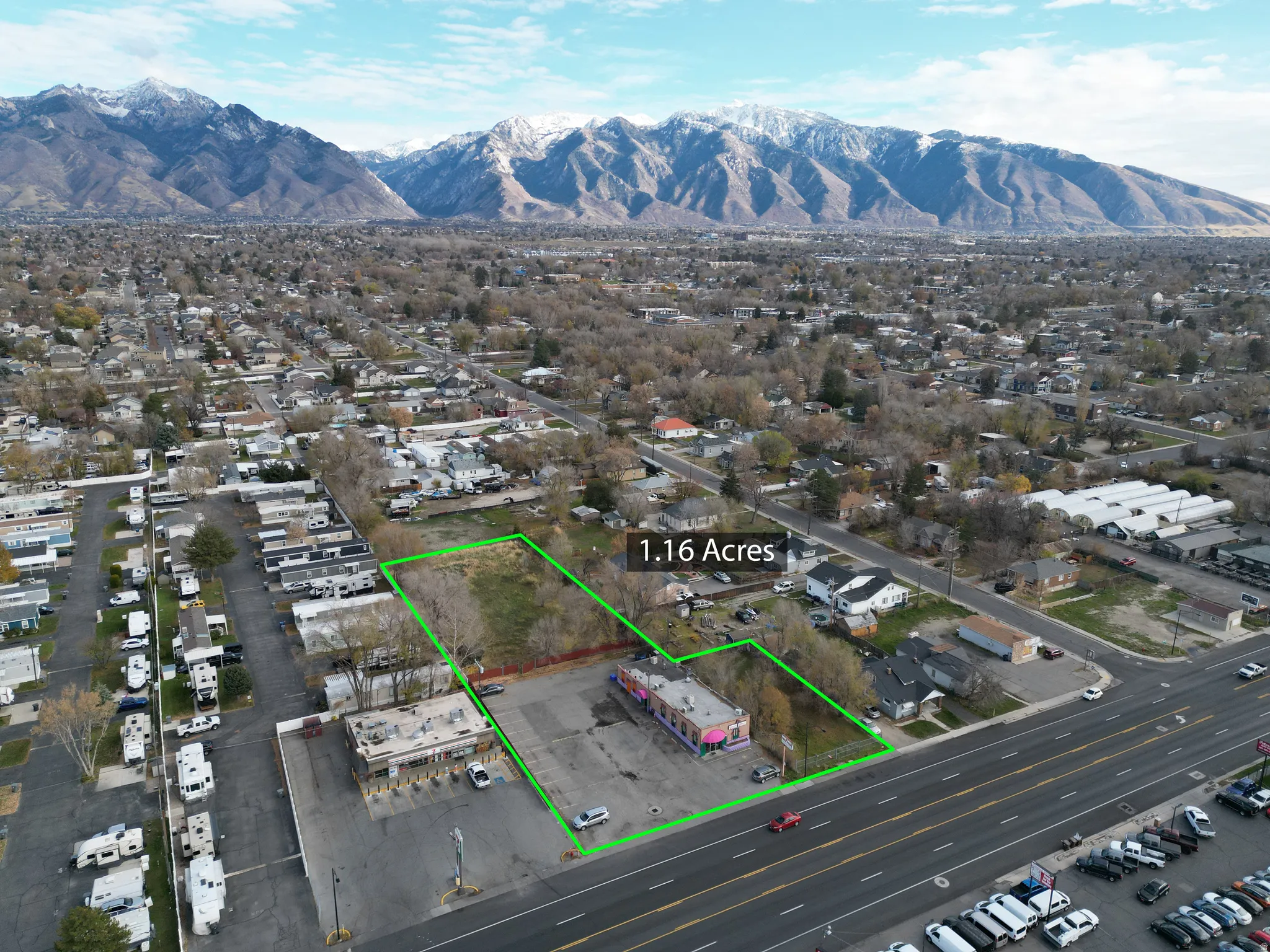 Aerial overview of property's location with property parcel outlined and a mountain backdrop