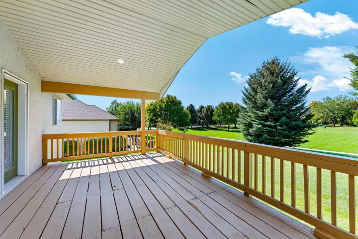 Wooden deck featuring a yard