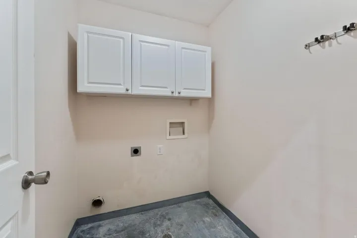 Laundry room with cabinet space, washer hookup, and hookup for an electric dryer