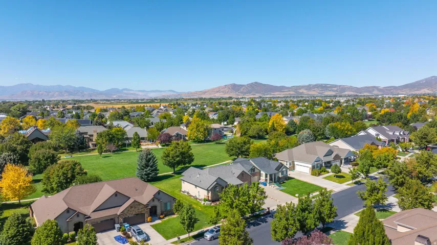 Aerial perspective of suburban area with a mountainous background