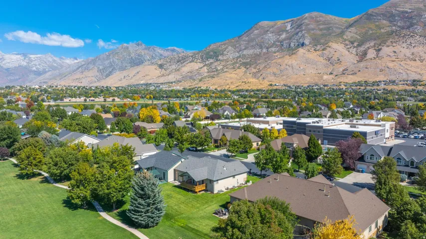 Aerial perspective of suburban area with a mountain backdrop