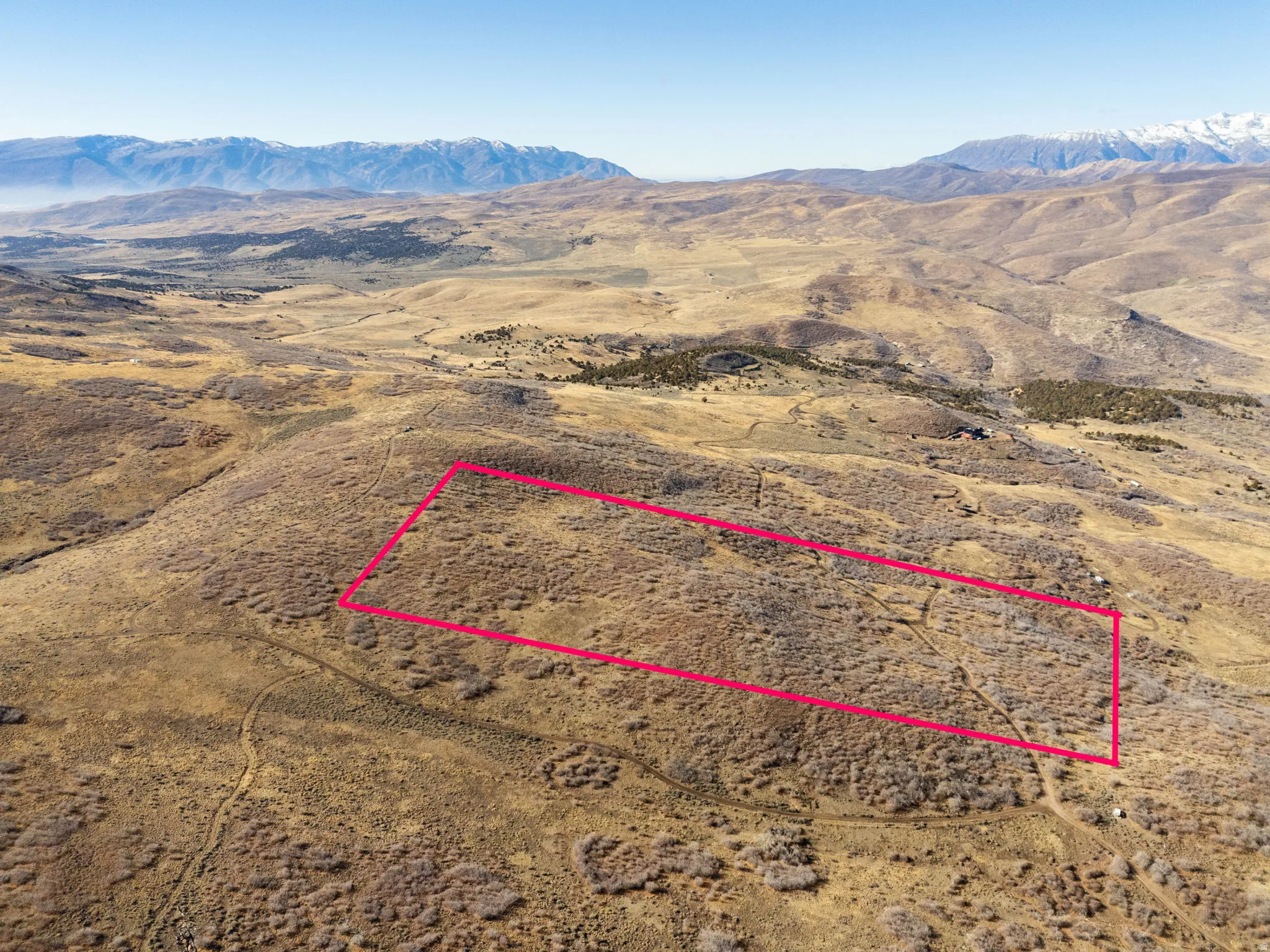View of rural area featuring property parcel outlined and a mountain backdrop