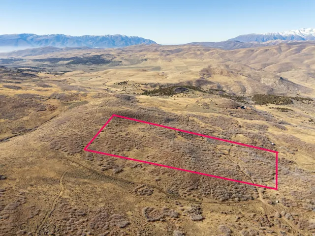 View of rural area featuring property parcel outlined and a mountain backdrop