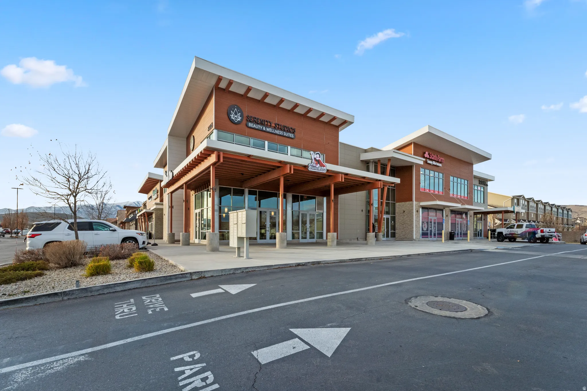 View of commercial location featuring uncovered parking