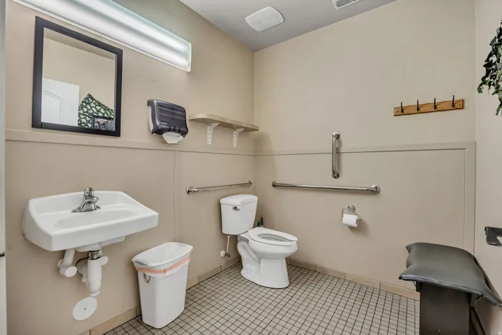 Half bath with light tile patterned floors