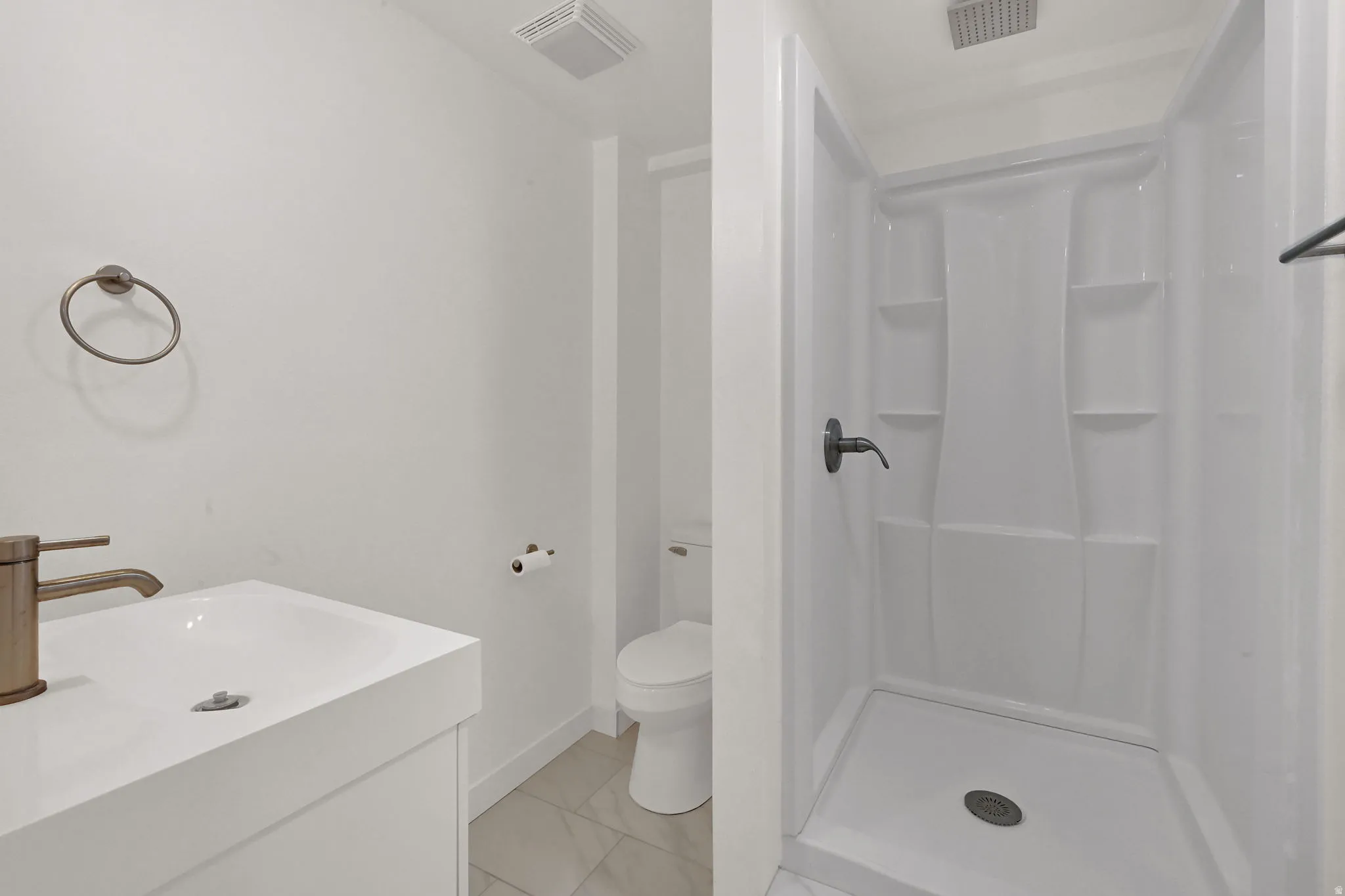 Bathroom with vanity and shower