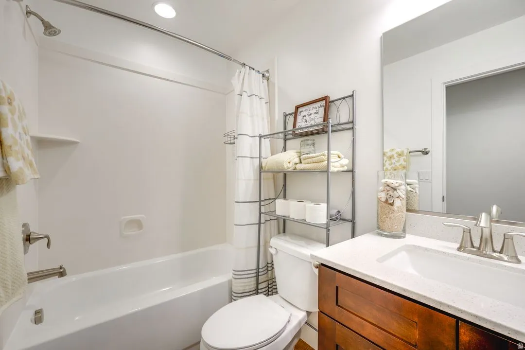 Full bathroom featuring vanity and shower / tub combo