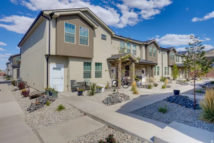 View of front of house featuring a residential view and stucco siding