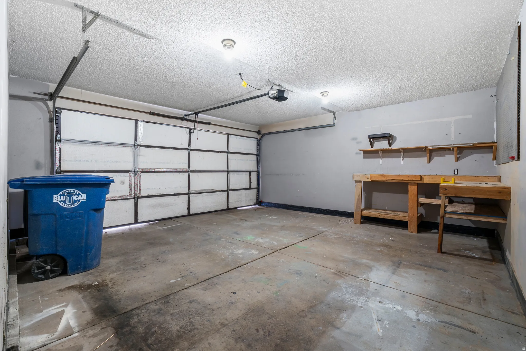 Garage featuring a garage door opener