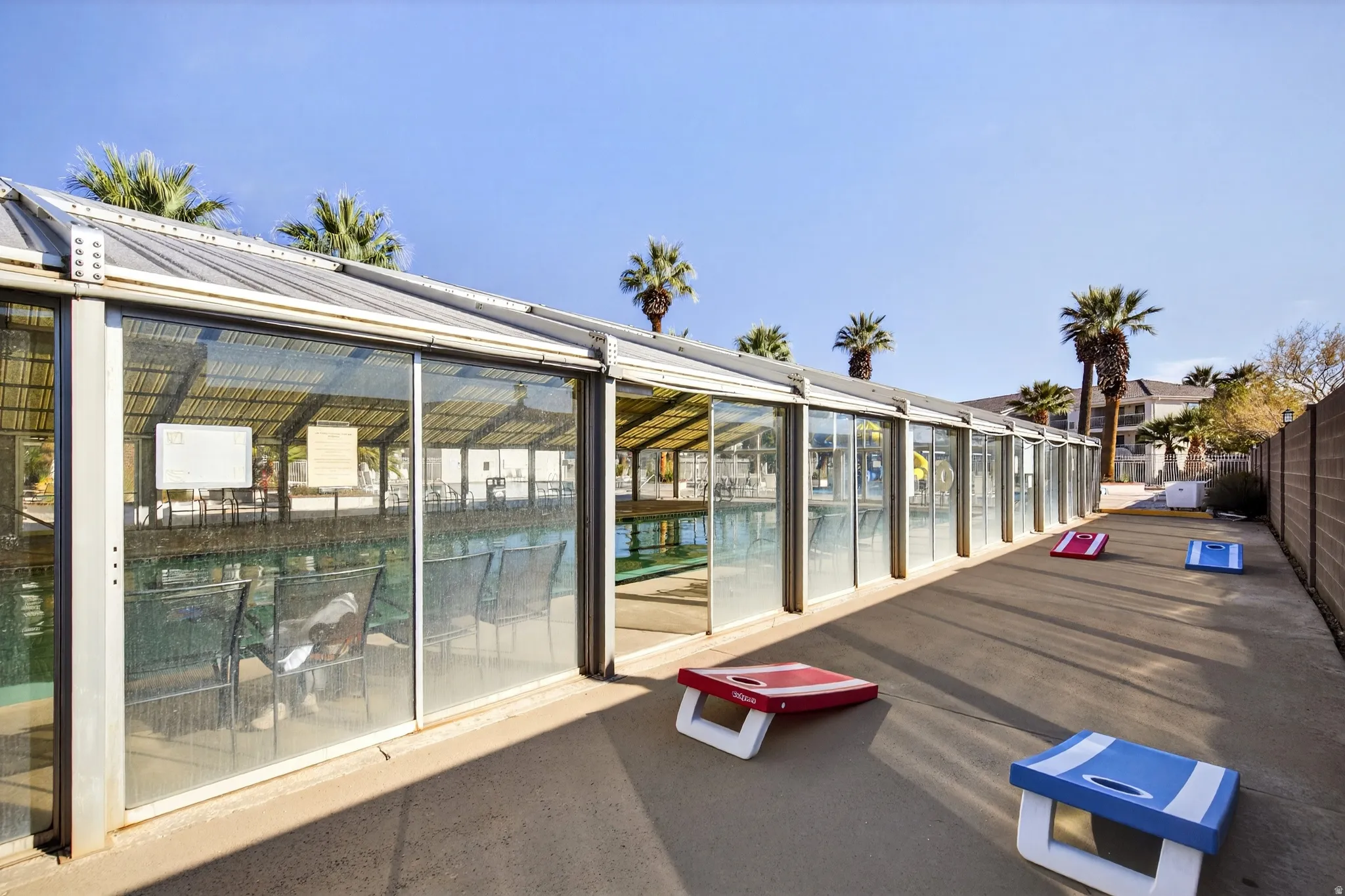 Deck featuring a sunroom and a patio area
