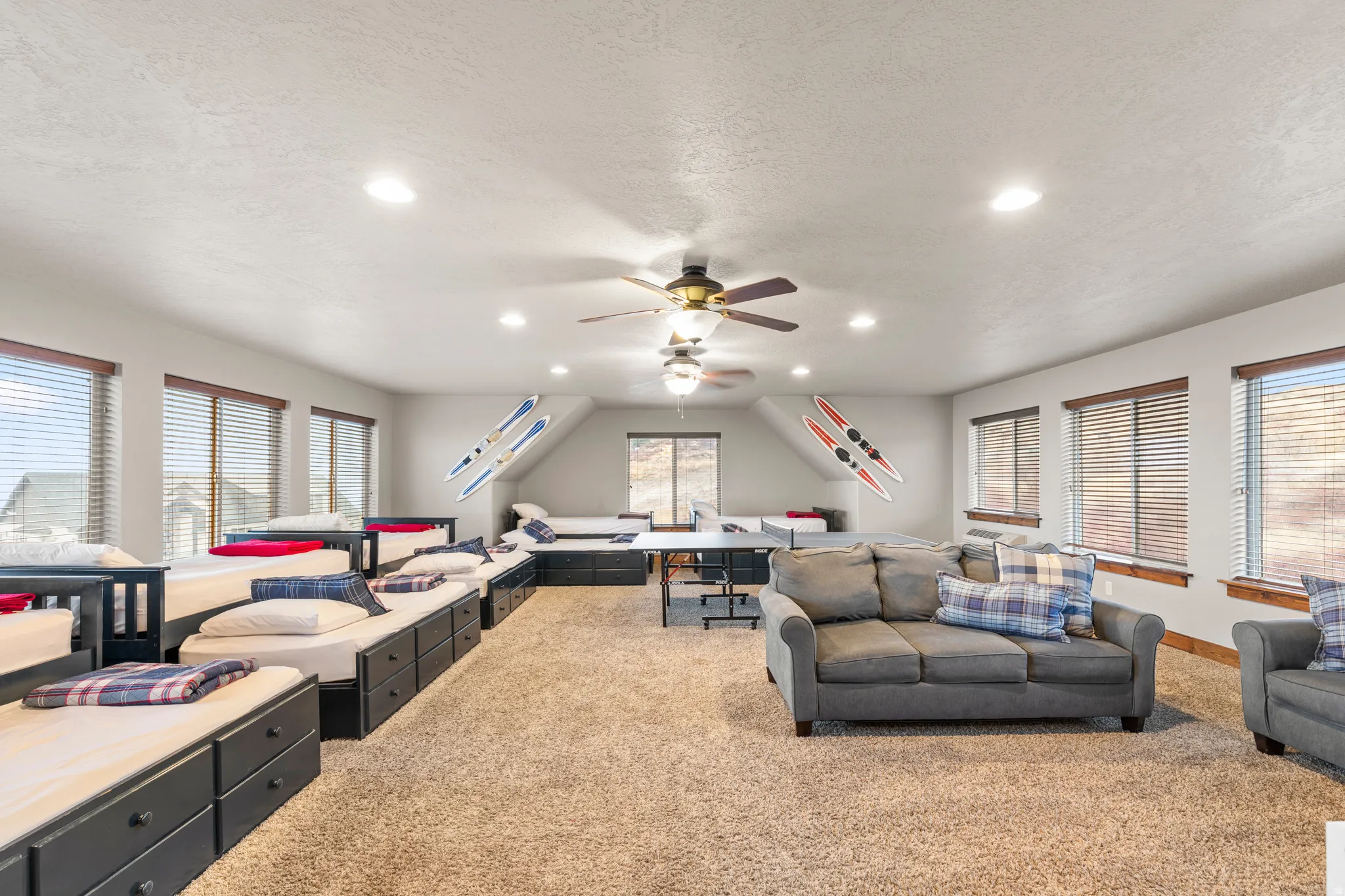 Living room featuring light colored carpet, recessed lighting, a textured ceiling, and ceiling fan