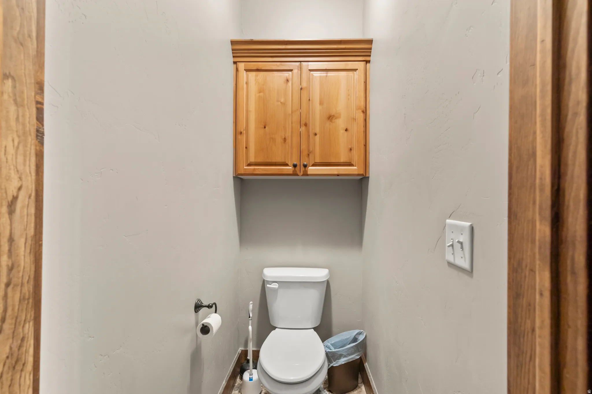 Bathroom featuring toilet and baseboards